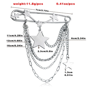 Close-up of hip hop silver star brooch with layered tassel chains and crystal details
