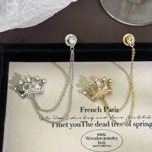 British style crown brooches with chain tassels in gold and silver set on velvet