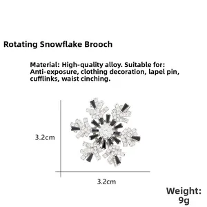 Macro shot of silver snowflake brooch with black and white zircon stone inlay