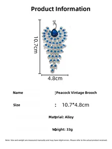 Detailed size chart showing 10.7cm length for peacock brooch with blue rhinestones