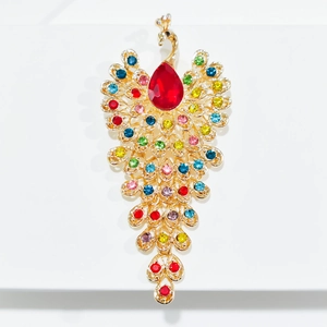 Luxurious peacock brooch with large red crystal and multi-colored rhinestones on gold base