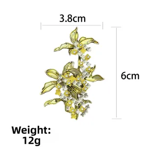 Osmanthus flower brooch with yellow enamel petals and dimensions 3.8cm x 6cm
