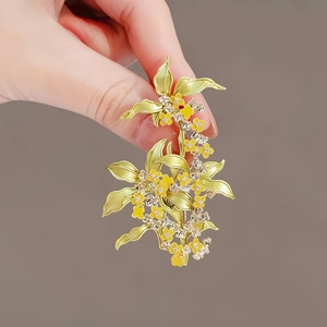 Elegant vintage osmanthus flower brooch with green enamel leaves and yellow crystals