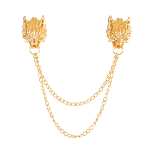 Golden wolf head double chain brooch with intricate metallic design on white background