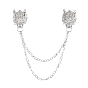 Close-up of vintage silver wolf head brooch with double layer chains on white background