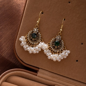 Vintage bohemian gold earrings with green gemstone and cascading pearl tassels