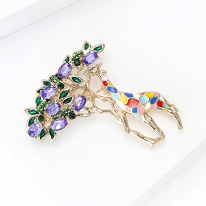 Detailed view of gold-plated giraffe brooch with colorful enamel and crystal accents