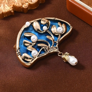 Vintage gold and blue fan-shaped brooch with white pearls and seaweed branch pattern