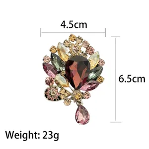 Luxurious vintage palace style brooch with colorful gemstones and purple drop pendant