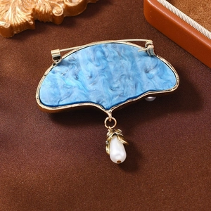 Vintage blue fan-shaped brooch with golden frame and hanging pearl teardrop accessory