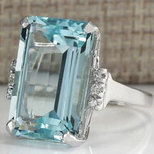 Elegant rectangle cut sky blue gemstone ring with side diamond accents in silver finish