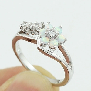 Elegant floral opal ring with white zircon stones and curved silver-plated split band
