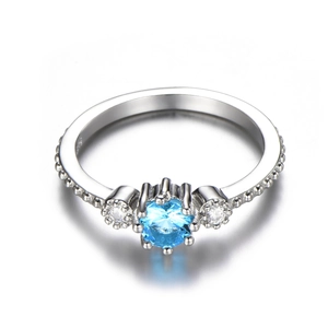 Macro detail of S925 sterling silver ring with sea blue gemstone and beaded edge