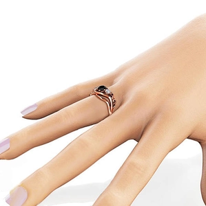 Roségouden ring met zwarte zirkoon en pavé-accenten op een golvende band