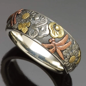 Vintage silver ring with embossed dragonfly and flower patterns in tricolor metal finish