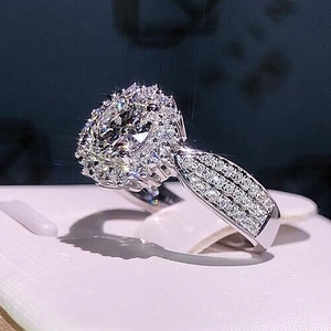 Luxury round halo diamond ring with triple-row pavé band in silver stainless steel