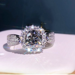 Classic silver-toned halo ring with a large round cubic zirconia and pavé-set band