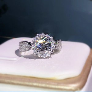 Luxury square princess cut halo engagement ring with pavé diamond band on a white stand