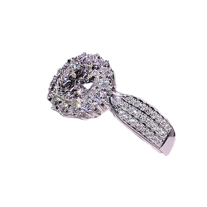 Sparkling Halo Engagement Ring with Large Round Center Stone and Pavé Setting