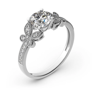 Sparkling silver bow ring featuring a round brilliant center stone with pavé butterfly accents