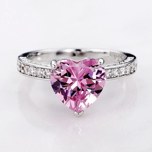 Macro shot of S925 stamped silver ring band featuring a pink heart-shaped AAA zircon