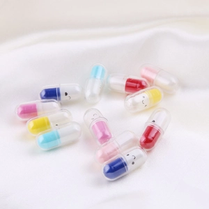 Colorful DIY capsule charms with smiley faces scattered on white silk fabric background
