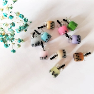 DIY colorful bubble tea resin charms with hooks for jewelry making on white background