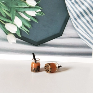 Detailed close-up of 2 mini resin bubble tea charms with black pearls and straws