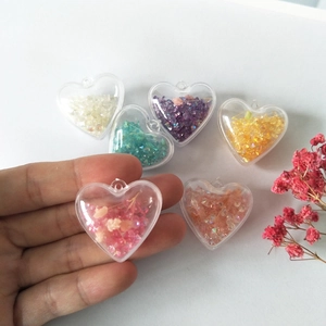 DIY heart acrylic pendants with colorful sequins and dried flowers for jewelry making