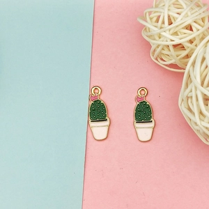 Detail of cactus charms for DIY jewelry with green enamel and pink flowers decoration