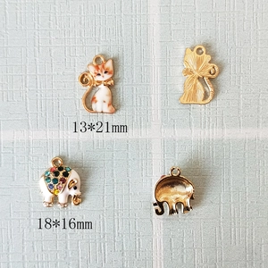 DIY gold alloy pendants featuring enamel cat and rhinestone elephant charms for jewelry