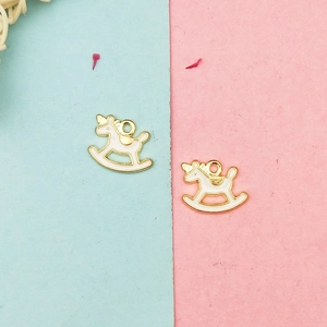 Detail of cream enamel rocking horse pendants with gold plating for DIY jewelry
