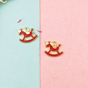 Detail of red enamel rocking horse charms with gold edges for DIY jewelry making