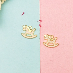 Detail of pink and white unicorn rocking horse pendants for DIY jewelry making