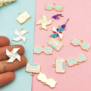 DIY colorful enamel charms featuring windmill, heart glasses, and cassette tape shapes