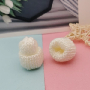 Set of two white miniature knitted beanies for dolls and DIY handicraft accessories
