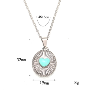 Vintage silver steel oval pendant necklace with light blue heart and radial texture