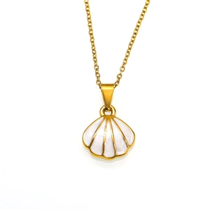 Detail of a gold scallop pendant necklace with white enamel inlay and fine metal chain