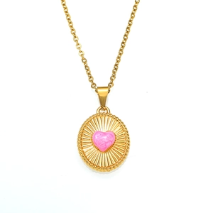 Vintage 18K gold plated necklace with a pink rose heart pendant on a sunburst disk