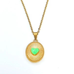 Vintage 18K gold plated titanium necklace with green heart pendant and sunburst relief