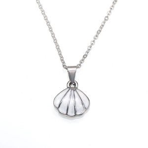 Detailed close-up of a silver scallop shell pendant with white enamel on a link chain