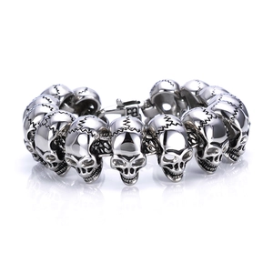 Macro shot of punk style stainless steel skull bracelet links with detailed textures