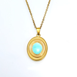 Elegant gold titanium necklace with a sunburst-textured oval turquoise pendant