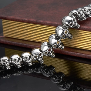 Macro view of detailed skull link chain in stainless steel with a punk gothic style