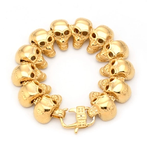 Bracelet gothique punk pour homme avec têtes de mort dorées et fermoir mousqueton