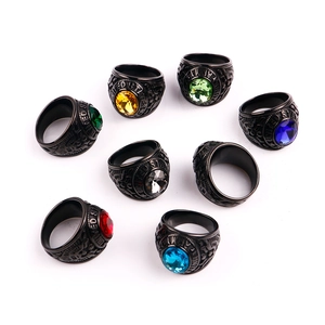 Vintage black military army rings set with colorful gemstone inlays on white background