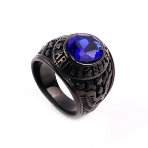 Detail showing vintage US Army style ring in black steel with a blue faceted gemstone