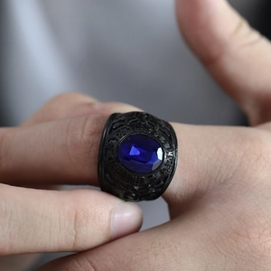 Macro detail of men's military ring with blue stone and United States Army engraving