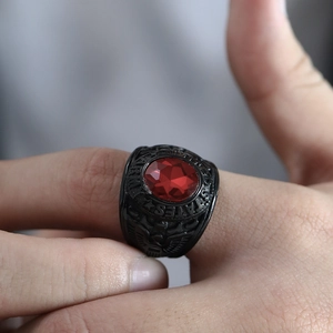 Macro detail of military steel ring with red stone and United States Army engraving
