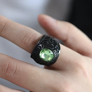Detail of vintage military steel ring with green stone and United States relief